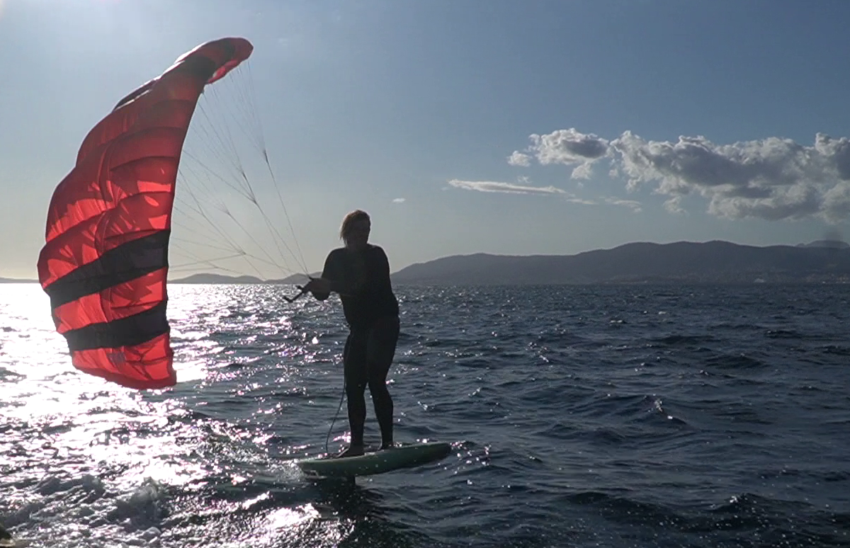 Rider using Freefly parawing for smooth foil riding and downwind performance